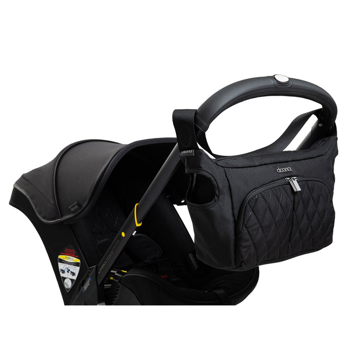 Doona Infant Car Seat + Base + Essentials Bag - Midnight Edition